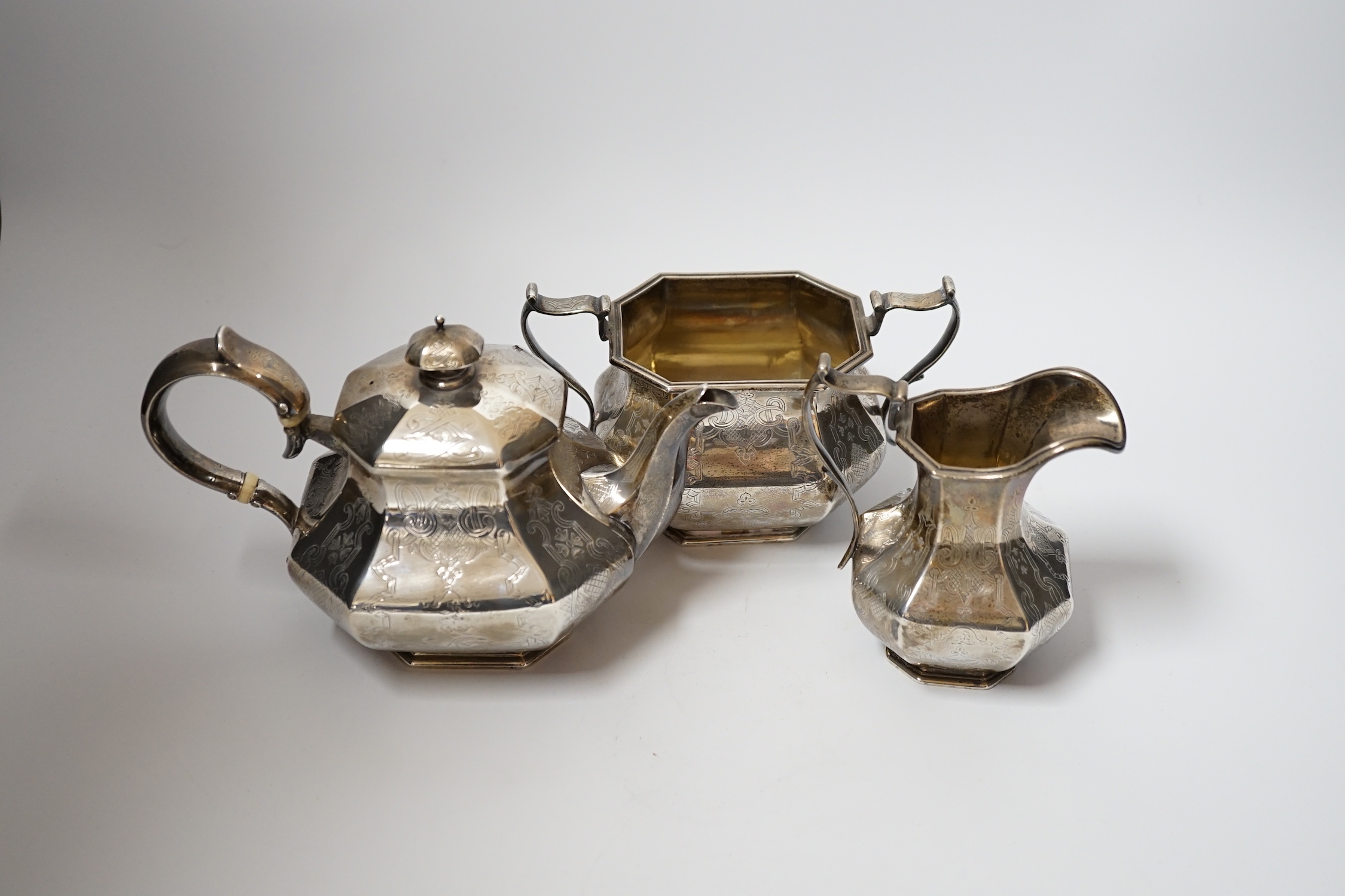 A matched Victorian three piece silver octagonal tea set, teapot, Reily & Storer, London, 1840, cream jug and sugar bowl, James McKay, Edinburgh, 1861, gross weight 28.9oz. CITES Submission reference A8T6W2KQ